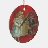 Krampus speelt met meisje keramisch ornament (Rechts)