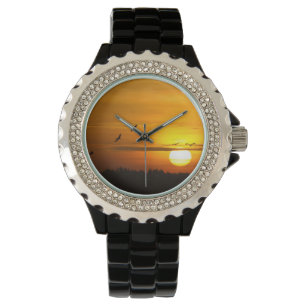 Kranen bij zonsopgang horloge
