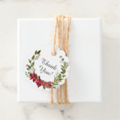 Krans van rode poinsettia bruidsborrel bedankjes labels (In situ)