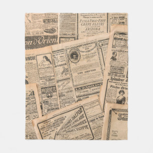 Krantenpagina's met antiek adverteren. Vintage Fleece Deken