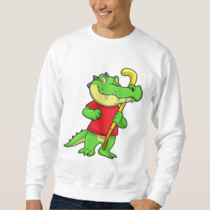 Krokodil bij veldhockey met stick trui