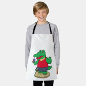 Krokodil met bloemen schort (Gedragen)