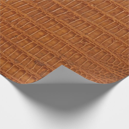 Krokodilalligator reptielleder textuur dicht bij e cadeaupapier (Hoek)