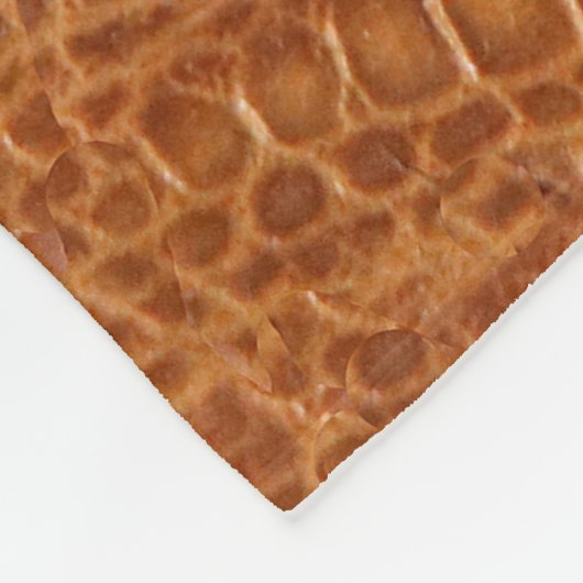 Krokodilalligator reptielleder textuur dicht bij e fleece deken (Hoek)