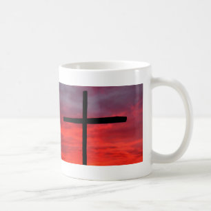 Kruis tegen zonsopgang koffiemok