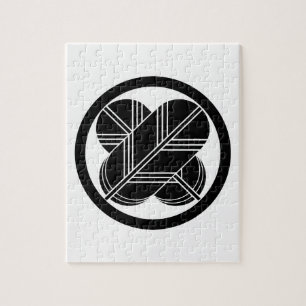 Kruisende havikveren met voet in cirkel legpuzzel