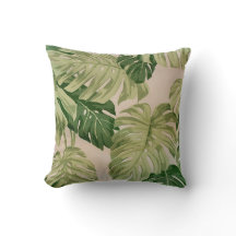 kussen met groen bladeren