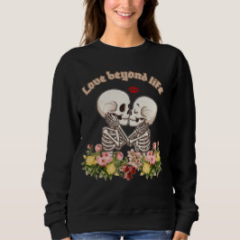Kussend skeletkoppel met bloemrijke gotiek trui