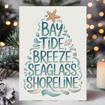 Kust Kerstboom Beach Feestdagen Kaart<br><div class="desc">Vier het vakantieseizoen met kustvibes! Deze "Bay Tide Breeze Seaglass Shoreline" kerstkaart brengt een frisse, luchtige sfeer met zijn oceanische ontwerp. Met elementen aan zee zoals zeesterren, schelpen en rustgevende blauwe tinten, is deze kaart perfect voor iedereen die van het strand houdt. Of je nu warme kerstwensen uit de kust...</div>