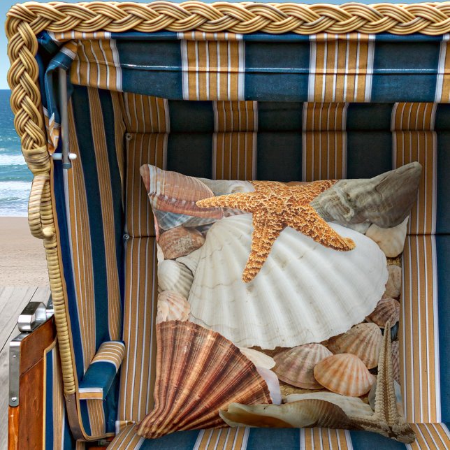 Kuststrand Buitenkussen (A modern design beach house pillow featuring shells and starfish)