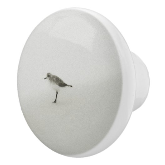 Kustzandloper op het strand keramische knop (Rechts)