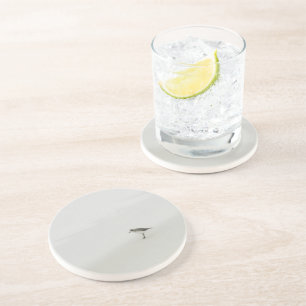 Kustzandloper op het strand zandsteen onderzetter