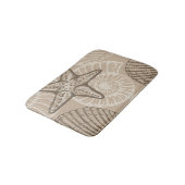 Kustzeesterren en schelpen in beige badmat (Gekanteld)