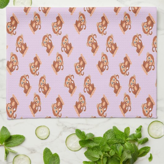 Kute bruine aap op paars theedoek (Gevouwen)