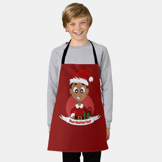 Kute kerstjongen met donkerbruin haar schort (Gedragen)