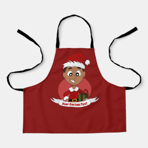 Kute kerstjongen met donkerbruin haar schort