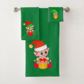 Kute kerstkleppen op groen bad handdoek (Insitu)