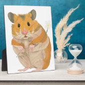 Kute kleine hamster met een bloem fotoplaat (Zijkant)