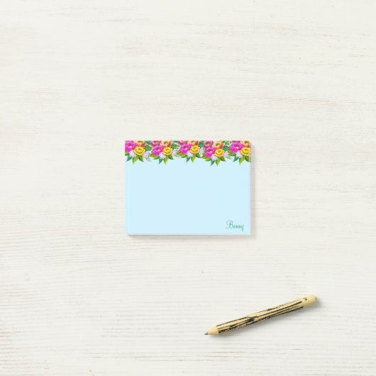 Kute meerkleurige bloemen op lichtblauw post-it® notes (Op bureau)