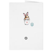 Kute paasbunny, eieren en roze op lichtblauw (Achterkant)