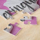 Kwalies op roze papieren cadeau legpuzzel (Zijkant)