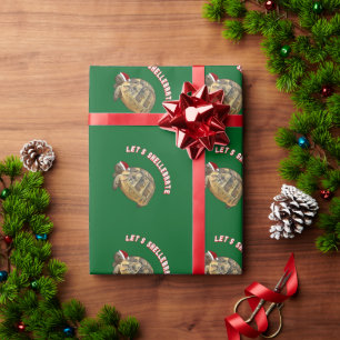 Laat de kerstschildpad met de kerstman die de kers cadeaupapier