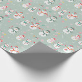 Laat het sneeuwsneeuwmannen op groen cadeaupapier (Hoek)