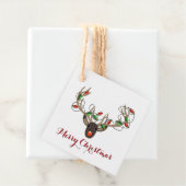 Label met cadeau voor prettige kerstrennieren (In situ)