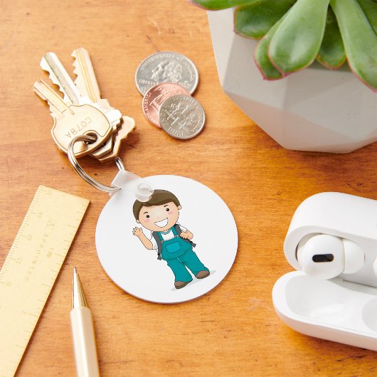 Lachende schooljongen met rugzak sleutelhanger