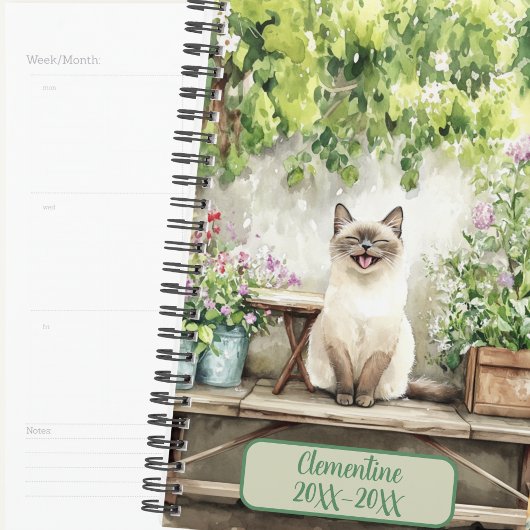 Lachende Siamese Kat On gedateerd Agenda