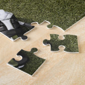 Lacrosse sticks, handschoenen en kogelballen op ku legpuzzel (Zijkant)