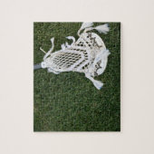 Lacrosse-stok op gras legpuzzel (Verticaal)