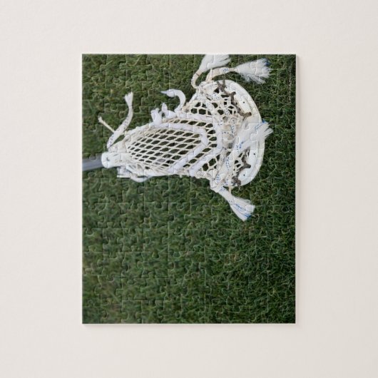 Lacrosse-stok op gras legpuzzel (Verticaal)