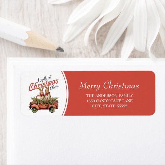 Ladingen van Kerstmis Cheer Konijnen in Rode Vrach Etiket (Insitu)