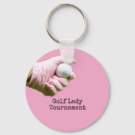 Lady golfer houdt golfbal op een roze achtergrond sleutelhanger