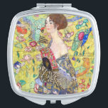 Lady met Fan van Gustav Klimt,  Japonisme Handtas Spiegeltje<br><div class="desc">Lady with Fan (1918) van Gustav Klimt is een Victoriaans schilderij van het symboliek van het tijdperk van het symboliek in de kunst. Een mooie brunette vrouw met een oosterse fan. De gouden florale Japanse achtergrond zit vol met bloeiende exotische bloemen, pauw en andere vogels met uitgestrekte vleugels. Over de...</div>