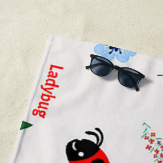 Ladybug-patroon op grijs strandlaken