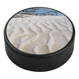 Lage getijde hockey puck