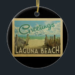 Laguna Beach Vintage Travel Keramisch Ornament<br><div class="desc">Deze groeten van Laguna Beach  briefkaart zijn voorzien van een zandig strand met een prachtig turquoise oceaanwater en boven het zee,  een blauwe hemel met blauw witte wolken. In de klassieke reisstijl.</div>