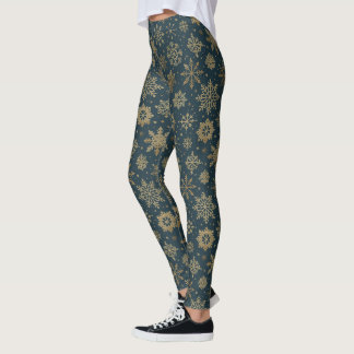 Landelijke gouden sneeuwvlokken op donkergroen leggings