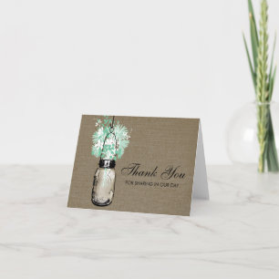 Landelijke juten pot gevuld met wilde bloemen bedankkaart