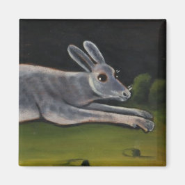 Lang grijze konijn springt over velden magneet