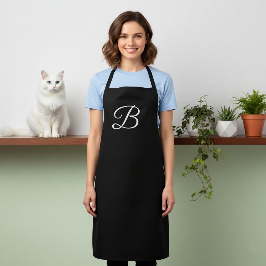 Lange effen zwarte apron met monogram schort
