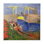 Langlois Bridge in Arles door Vincent van Gogh Tegeltje<br><div class="desc">Langlois Bridge in Arles door Vincent van Gogh is een kunstschilderij van het impressionisme op zee, waar paastische vrouwen kleding wassen in de kreek. Over de kunstenaar: Vincent Willem van Gogh was een Post Impressionistische schilder wiens werk het meest opmerkelijk was voor zijn ruige schoonheid, emotionele eerlijkheid en gewaagde kleur....</div>