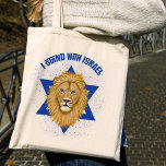 Leeuw van Juda, ster van David. Ik sta achter Isra Tote Bag<br><div class="desc">Deze stijlvolle canvas tas show uw steun voor Israel! Een grafisch schilderij van de Leeuw van Juda is het middelpunt, over de achtergrond van de Davidster. In het blauw staat "I Stand with Israel". Een getextureerde blauwe achtergrond voegt een grunge look toe. *Kunstwerk exclusief gemaakt door Tracey Khalei / Orabella...</div>
