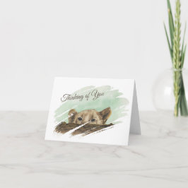 Leeuwenwelpje gluren over een log note Kaart