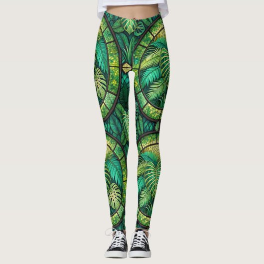 Leggings featuring a vibrant green tropical leaf  (Voorkant)