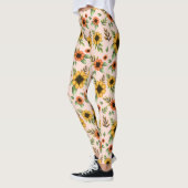 Leggings versierd met een levendig zonnebloempatro (Links)