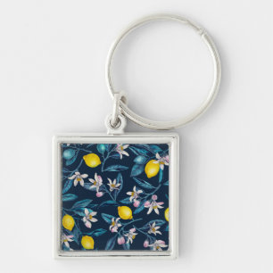 Lemon branches with blossoms and fruit on blue sleutelhanger
