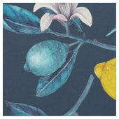 Lemon branches with blossoms and fruit on blue stof (Close Up)